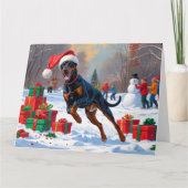 Carte Doberman coule dans la neige avec le Casquette de (Devant)