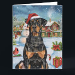 Carte Doberman Winter Wonderland Christmas Joy<br><div class="desc">Ce design festif reflète l'esprit joyeux de la période des fêtes, avec un adorable petit portant un chapeau de Père Noël. Le chien est niché dans un pays des merveilles hivernales, avec un bonhomme de neige, un sapin de Noël décoré et des cadeaux joliment emballés. Les flocons de neige tombent...</div>
