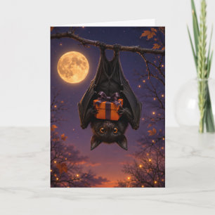 Carte Drôle de chauve-souris effrayante tenant un cadeau