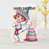 Carte Fille Kawii donnant un coup de pied dans un gâteau (Fleur jaune)