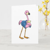 Carte Flamant rose comme secrétaire avec bloc-notes (Fleur jaune)