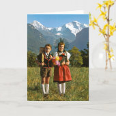 Carte Garçon et fille suisses (Fleur jaune)