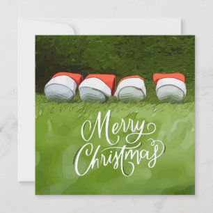 Carte Golf Joyeux Noël avec balle de golf sur herbe vert