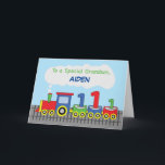 Carte Grandson 1er anniversaire Train coloré sur la voie<br><div class="desc">Votre petit-fils se souviendra de cette carte tant qu'il vivra et retournera à son joyeux jour d'enfance. Il se souviendra de cela comme de la toute première carte d'anniversaire qu'il a reçue et qui est personnalisée avec son nom. Donne-lui ceci une fois qu'il fêtera son 1er anniversaire.</div>