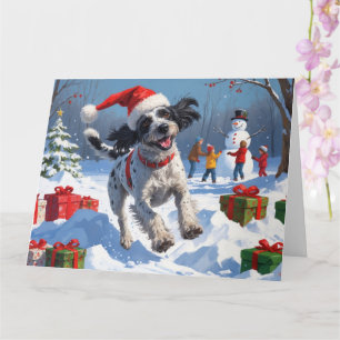 Carte Griffon à poil dur avec un chapeau de Noël enneigé