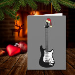 Carte Guitare cool Père Noël<br><div class="desc">Cool Electric guitare monochrome art avec noir et blanc mettant en valeur un drôle de chapeau de Père Noël. N'importe quel guitariste ou musicien vous dira que vous ne pouvez jamais avoir à beaucoup de guitares. Cette carte de voeux festive de guitare cool, idéale pour un adolescent, célèbre l'énergie et...</div>