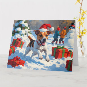 Carte Jack Russell courant dans la neige avec un chapeau