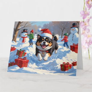 Carte Japanese Chin courant dans la neige avec un chapea