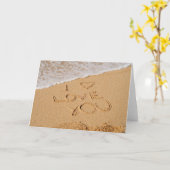 Carte Je t'aime écrit sur le sable (Fleur jaune)