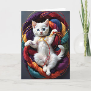Carte Joli chaton blanc jouant avec des rouleaux de fil 