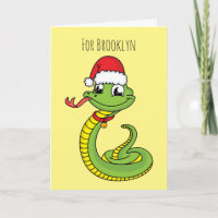 Joli serpent vert avec un chapeau de père Noël en 