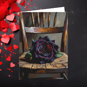 Carte Jolie rose noire sur une chaise rustique pour la S