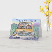 Carte Joyeux anniversaire, chien de corgi conduisant son (Fleur jaune)