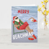 Carte Joyeux Beachmas Père Noël sur la plage Noël (Fleur jaune)