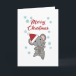 Carte Joyeux éléphant de Noël Eléphant de neige<br><div class="desc">Joyeux Noël avec un éléphant avec une chaîne de lumières.Une belle carte de voeux pour les amis le soir de Noël.Une belle carte de Noël hivernale avec un pachyderme.</div>