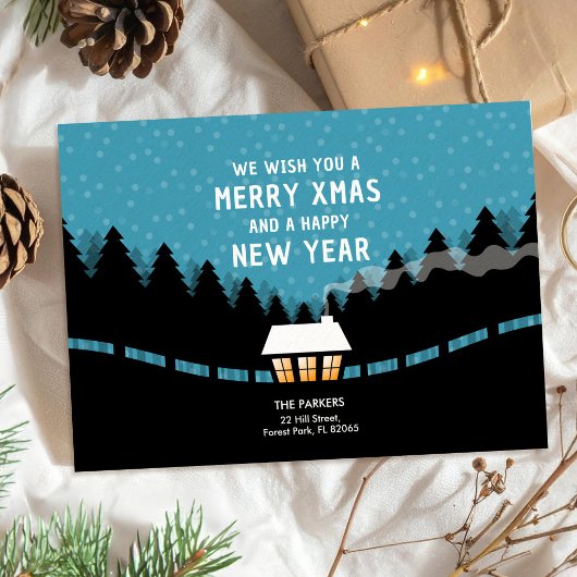 Carte Joyeux Noël bleu avec des pins rétro
