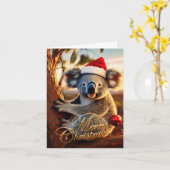 Carte Joyeux Noël Koala assis dans un eucalyptus (Fleur jaune)