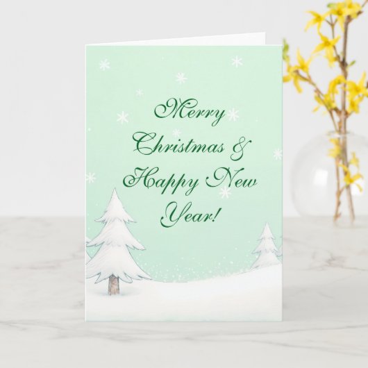 Carte Joyeux Noël vert et pins neigeux (Fleur jaune)