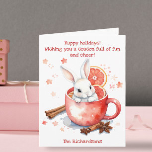 Carte Lapin mignon qui regarde dehors d'une tasse rouge 