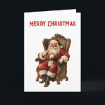 Carte Le Père Noël rétro assis en chaise Noël<br><div class="desc">Carte de Noël avec une image de style vintage représentant le Père Noël classique assis dans un fauteuil démodé. Joli design traditionnel de Noël.</div>