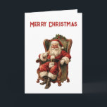 Carte Le Père Noël rétro assis en chaise Noël<br><div class="desc">Carte de Noël avec une image de style vintage représentant le Père Noël classique assis dans un fauteuil démodé. Joli design traditionnel de Noël.</div>