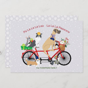 Carte Les chiens montant une bicyclette présente Noël de