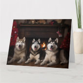 Carte Malamute en Alaska près de la cheminée Noël (Devant)