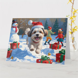 Carte Malti Tzu courant dans la neige avec un chapeau de