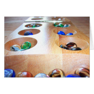 Carte Mancala avec pièces de jeu