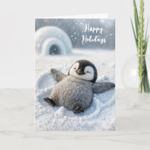 Carte Manchot de Noël poussin faisant un ange de neige