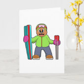 Carte Ours en skieur avec skis et bâtons de ski (Fleur jaune)