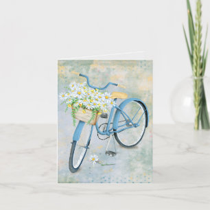 Carte panier de marguerite sur vélo bleu