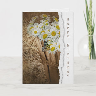 Carte papillon dans le panier de marguerite