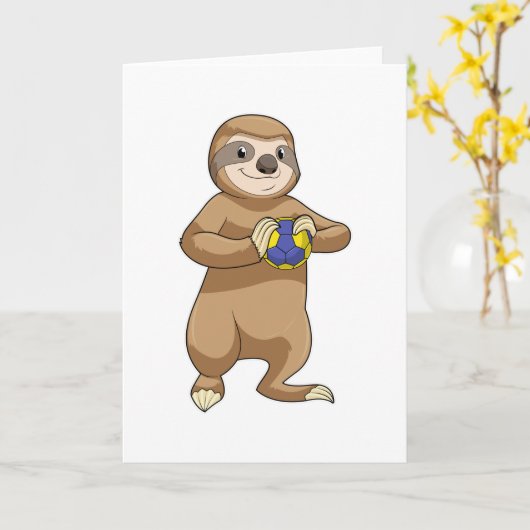 Carte Paresseux en joueur de handball avec un ballon de (Fleur jaune)