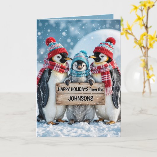 Carte Penguins de famille de Noël avec un panneau en boi (Fleur jaune)