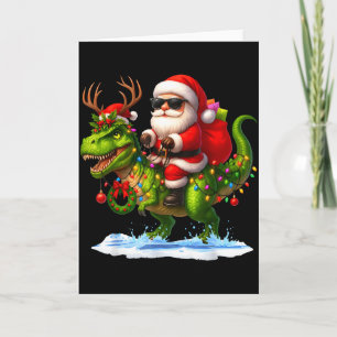 Carte Père Noël à cheval sur un dinosaure T Rex Noël Gar