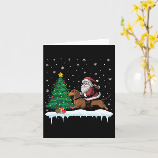 Carte Père Noël chevauchant un chien teckel garçons fill (Fleur jaune)