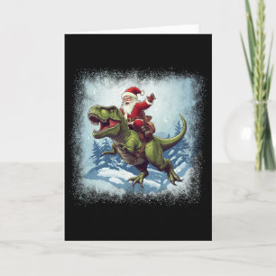Carte Père Noël chevauchant un dinosaure T-rex Noël drôl