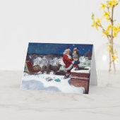 Carte Père Noël livrant une brassée de livres par N.C. W (Fleur jaune)