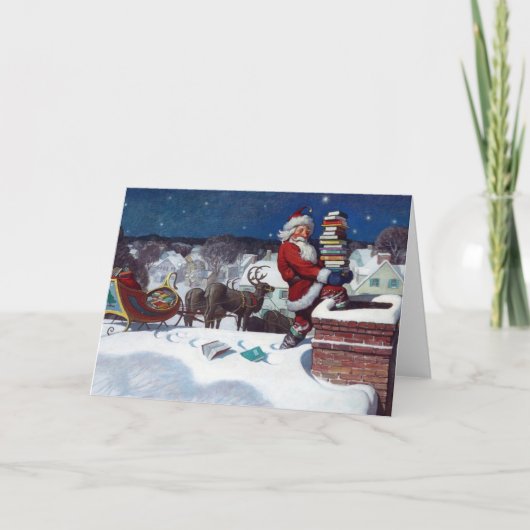 Carte Père Noël livrant une brassée de livres par N.C. W (Devant)