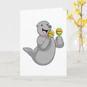 Carte Phoque comme musicien avec maracas (Fleur jaune)