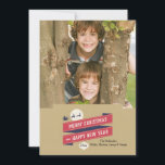 Carte photo joyeux de vacances<br><div class="desc">Un arrière - plan bronzage tient les rubans rouges avec le message "Joyeux Noël et bonne année". Père Noël et son traîneau se silhouette à l'arrière-plan et un ornement de Noël tient l'année. Il est facile customiser la carte avec vos mots, options de police, de couleur de police, de papier...</div>