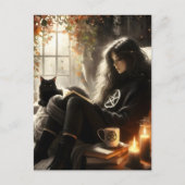 Carte Postale A witch reads with her black cat in a cozy chair (Devant)