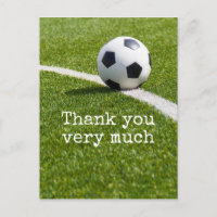 Boule de football avec Merci de mot sur herbe vert