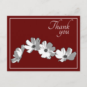 Carte Postale Chaîne de marguerites blanches sur fond rouge Merc