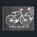 Carte Postale Chalkboard rose aile coeur vélo amour<br><div class="desc">Coeur ailé rose vintage sur un vélo contre un arrière - plan en damier décoré de tourbillons fleuris dans le coin supérieur droit (un objet en option) avec le texte "Allez où l'amour vous emmène" qui peut être changé ou supprimé. S'il vous plaît customisez-le pour répondre à vos besoins d'occasion....</div>