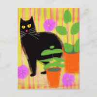 Chat noir mignon dans les plantes domestiques