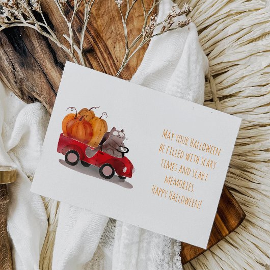 Carte postale de chat d'Halloween livrant une citr