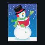 Carte postale de musique de chant de Noël de<br><div class="desc">Un bonhomme de neige chanteur exécute des chants de Noël dans la nuit. La neige et les notes musicales tombent doucement dans la carte postale de Noël.</div>