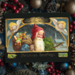 Carte postale de Noël Père Noël et Angles vintages<br><div class="desc">Carte de voeux vintage de l'époque victorienne avec Père Noël souriant entouré d'étoiles et de chérubs sur un arrière - plan sombre.</div>
